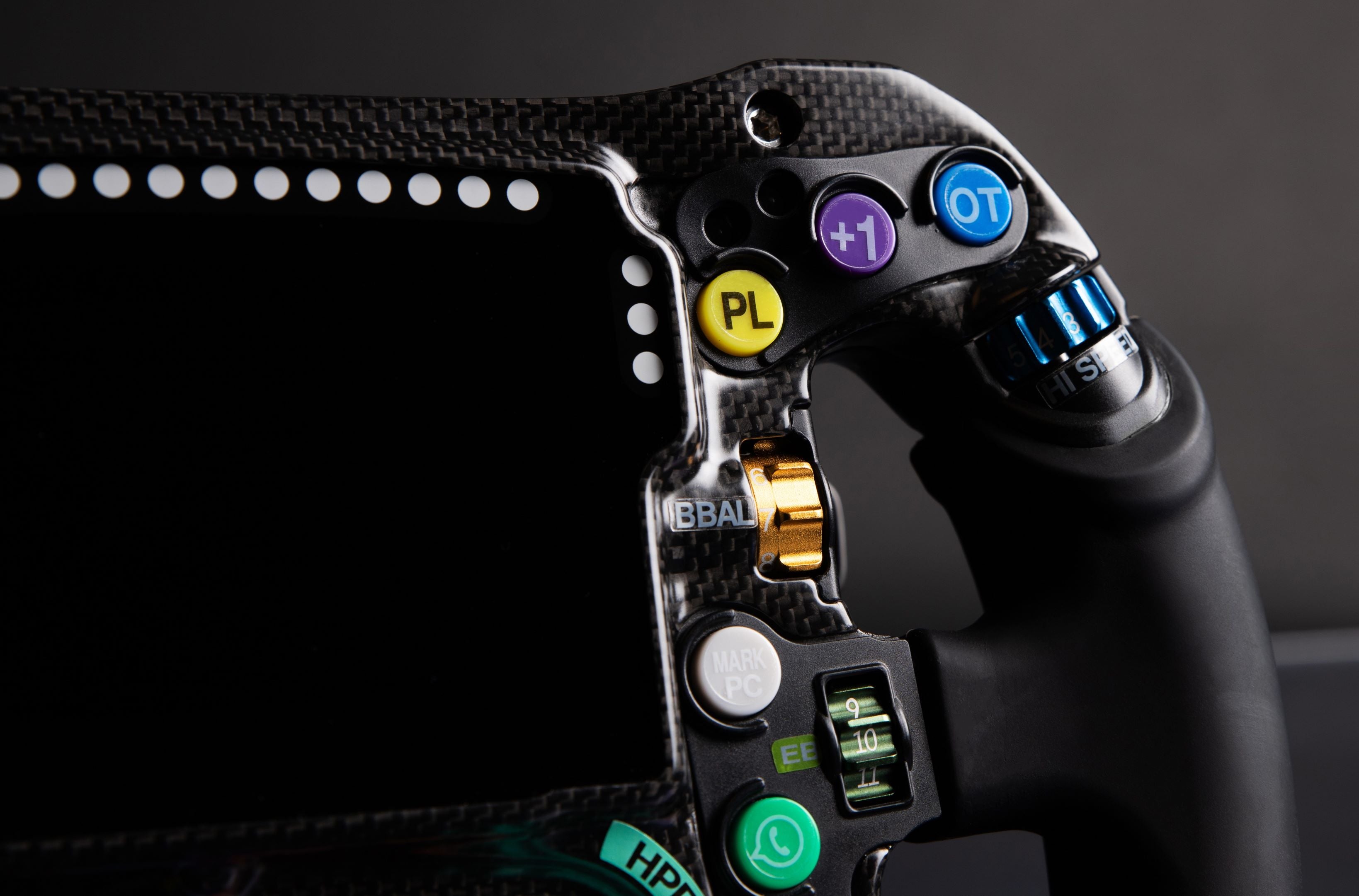 Ergonomic rubber silicone grips on the Mercedes-AMG PETRONAS Formula One Team Sim Racing Steering Wheel (2024). 