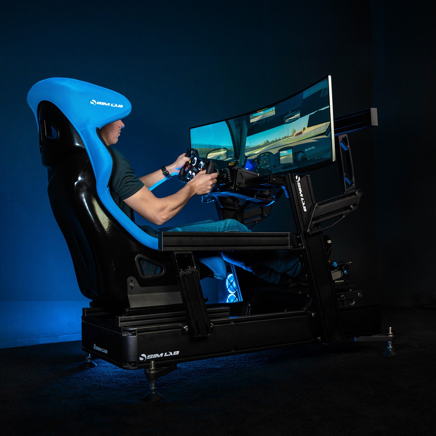 P1X PRO sim racing cockpit with the mounted wheelbase, XP1 pedals, and monitor